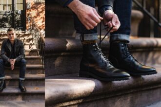 man sitting on steps in dark outfit, closeup photo of black leather boots