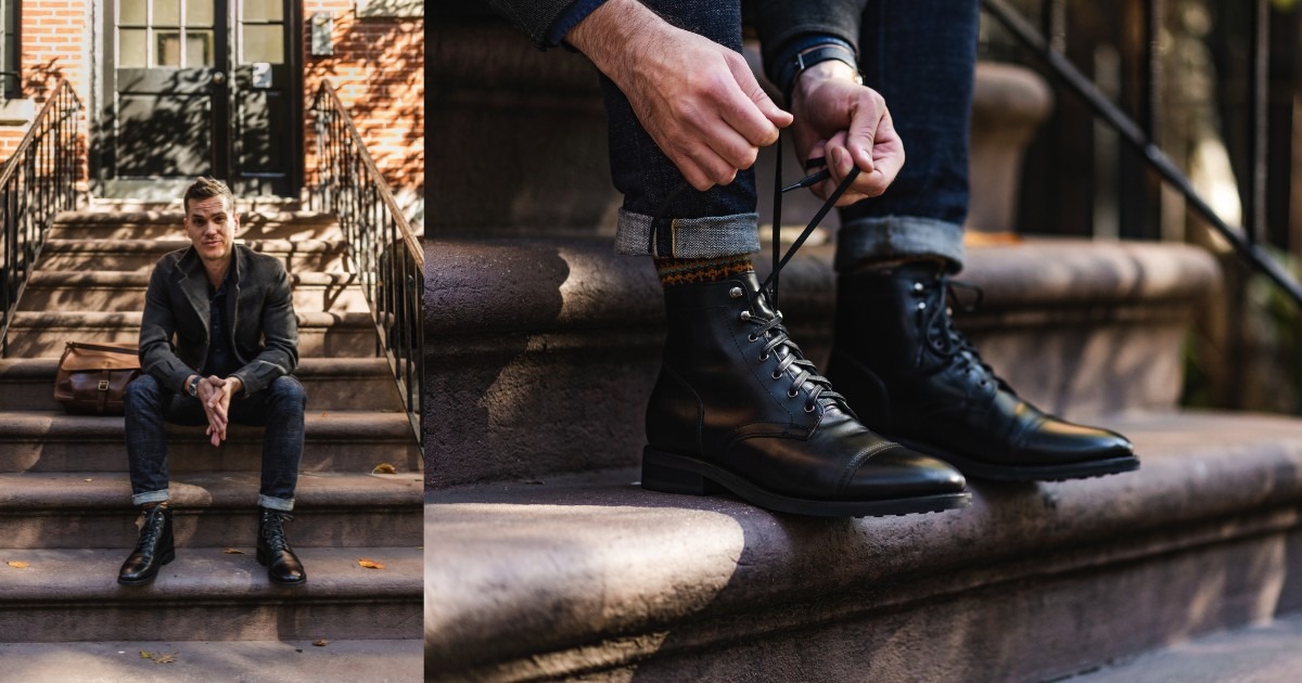 man sitting on steps in dark outfit, closeup photo of black leather boots