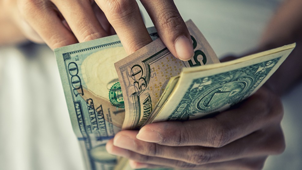 Man counting money by hand