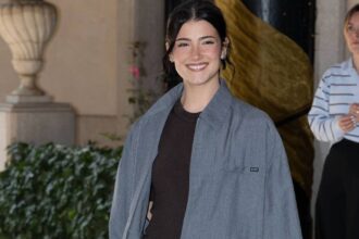 Charli D’Amelio’s Micro Shorts Play Peekaboo Under Coat for Fashion Week