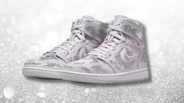 new nike x swarovski air jordan shoe with crystals overlaid on a sparkly white background