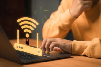 Cybersecurity and WiFi protection concept. WiFi router with a lock symbol appears above a laptop, representing secure internet