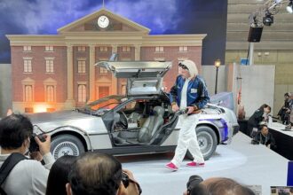 the-back-to-the-future-delorean-and-an-actor-playing-doc-brown-at-the-tamron-booth-at-cpplus-2026
