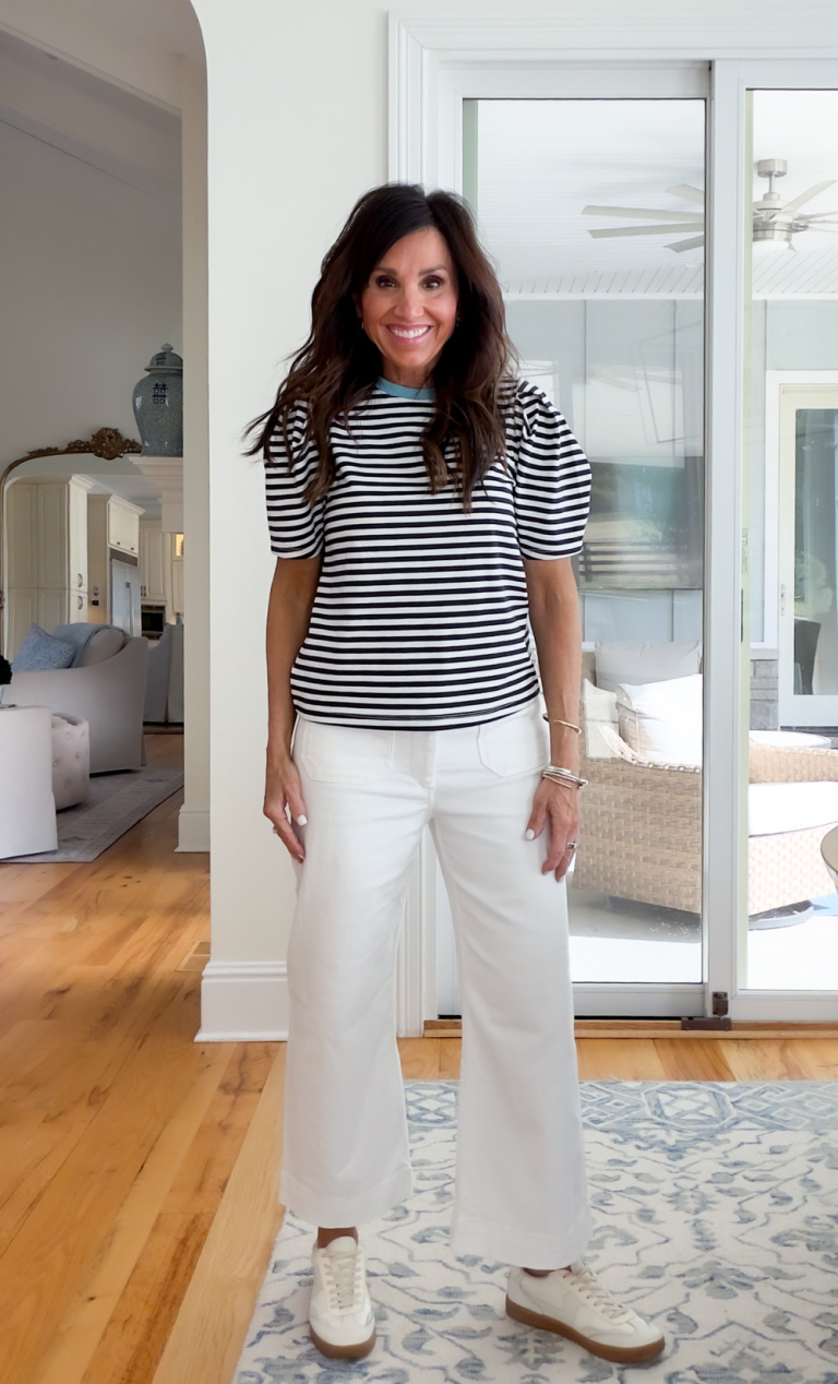 Cyndi spivey wearing a breton stripe tee and white jeans. 