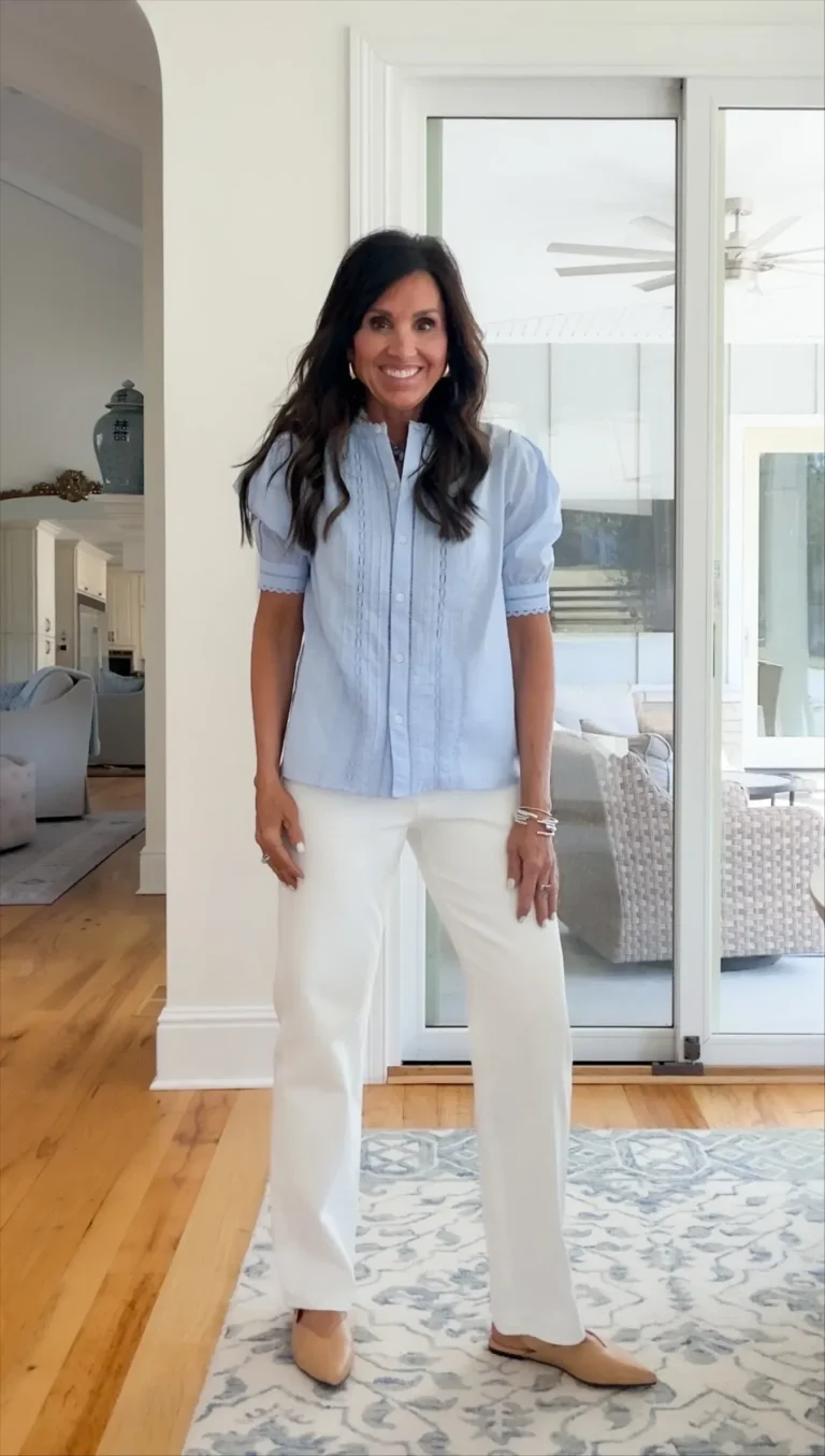 Cyndi Spivey wearing blouse with white jeans. 